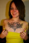 love angel tattoo on chest